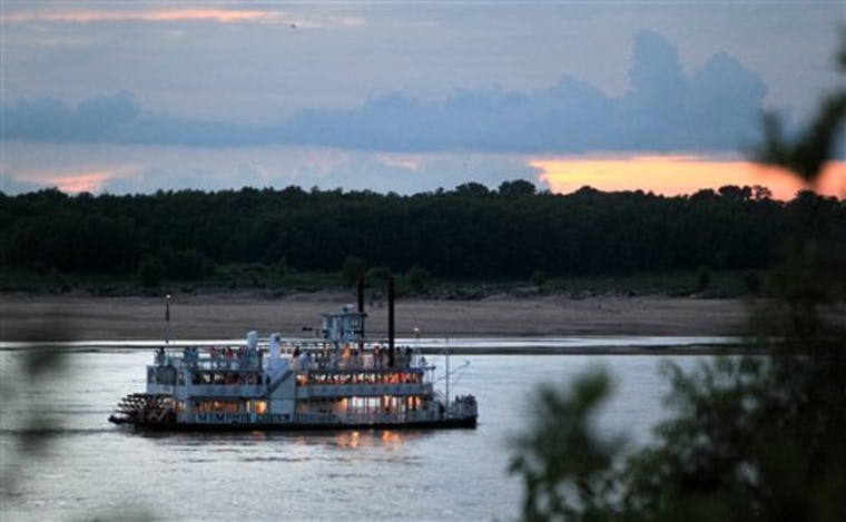 The Memphis Queen riverboat moves up the Mississippi River, in Memphis, Tenn. A year after nearly record floods, the Mississippi River level has dropped so low that it's beginning to affect commercial operations.